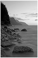 Boulders, surf, and Na Pali Coast, sunset. Kauai island, Hawaii, USA ( black and white)