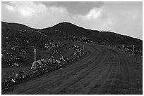 Unpaved road and volcanic landscape. Mauna Kea, Big Island, Hawaii, USA (black and white)