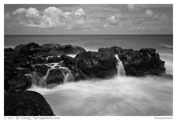Balsalt and surf motion. Kauai island, Hawaii, USA (black and white)