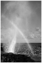 Spouting Horn with rainbow in spray. Kauai island, Hawaii, USA (black and white)