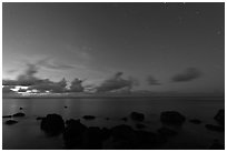 Rocks, ocean, and stars. Kauai island, Hawaii, USA (black and white)