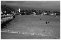 Beach, seawall and town, Kailua-Kona. Hawaii, USA ( black and white)