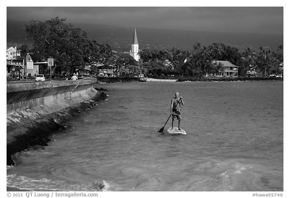 Paddlesurfer and Kailua-Kona. Hawaii, USA