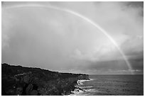 Rainbow over volcanic costline. Big Island, Hawaii, USA ( black and white)