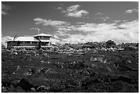 House and recently hardened lava. Big Island, Hawaii, USA (black and white)