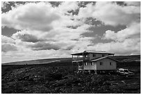 House built over fresh lava fields. Big Island, Hawaii, USA ( black and white)