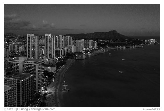 Aerial view of Waikiki Beach, skyline, and Diamond Head at night. Honolulu, Oahu island, Hawaii, USA (black and white)
