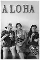 Family with Hawaiian Shave Ice under Aloaha letters, Paia. Maui, Hawaii, USA ( black and white)