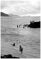Children playing in water near Fugaalu. Pago Pago, Tutuila, American Samoa (black and white)