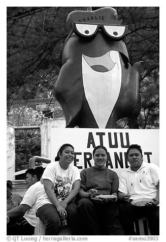 Women in front of statue of Charlie the Tuna. Pago Pago, Tutuila, American Samoa (black and white)