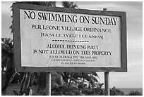 Sign prohibiting activities on Sunday. Tutuila, American Samoa (black and white)