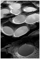 Ancient grinding stones holes (foaga) near Leone. Tutuila, American Samoa (black and white)