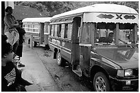 Colorful aiga busses, Pago Pago. Pago Pago, Tutuila, American Samoa ( black and white)