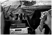 Hands of Aiga bus driver and sound system. Pago Pago, Tutuila, American Samoa ( black and white)