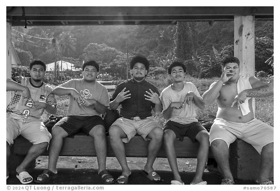 Boys at bus stop, Fagaitua Bay. Tutuila, American Samoa (black and white)