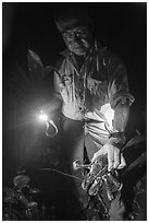 Tommy holding catched coconut crab at night, Ofu Island. American Samoa ( black and white)