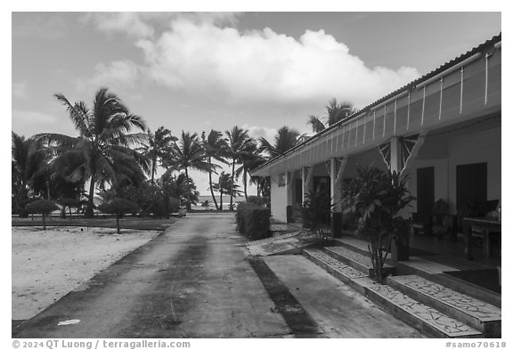 Store and beachfront, Olosega. American Samoa (black and white)