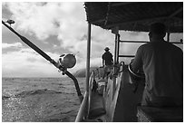 Alia boat approaching Tau Island. American Samoa ( black and white)