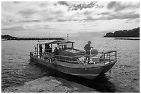 Alia boat departing from Fleasao harbor, Tau Island. American Samoa ( black and white)