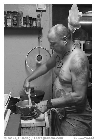 Manaia cooking, Tau Island. American Samoa (black and white)