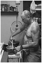 Manaia cooking, Tau Island. American Samoa ( black and white)