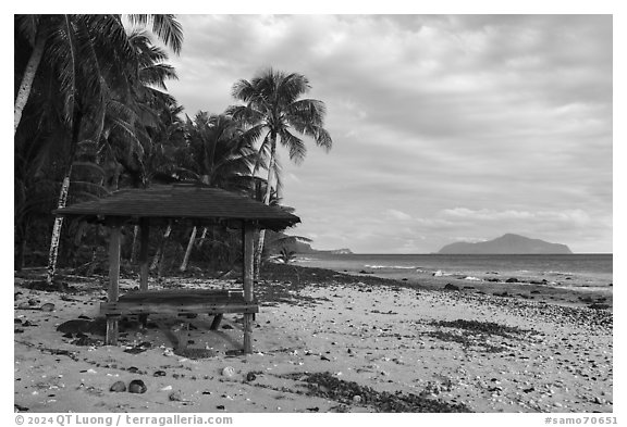 Beach shelter and Olosega Island, Tau Island. American Samoa (black and white)