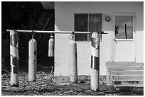 Scuba tanks used as curfew bells, Fagamalo. Tutuila, American Samoa ( black and white)