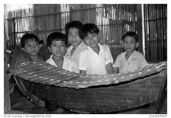 Boys with a traditional musical instrument. Phnom Penh, Cambodia (black and white)