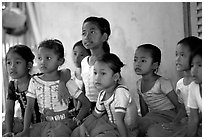 Girls learn traditional singing at  Apsara Arts  school. Phnom Penh, Cambodia ( black and white)