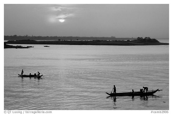 Boats at sunrise, Tonle Sap river,  Phnom Phen. Cambodia (black and white)