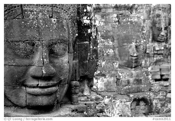 Serene and massive stone faces, the Bayon. Angkor, Cambodia (black and white)