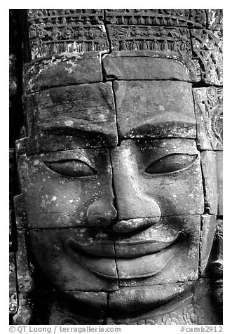 Enigmatic stone smiling face, the Bayon. Angkor, Cambodia (black and white)
