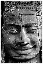Enigmatic stone smiling face, the Bayon. Angkor, Cambodia ( black and white)