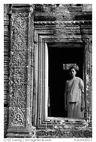 Buddhist monk in doorway, the Bayon. Angkor, Cambodia