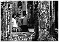Girls in temple complex, the Bayon. Angkor, Cambodia (black and white)