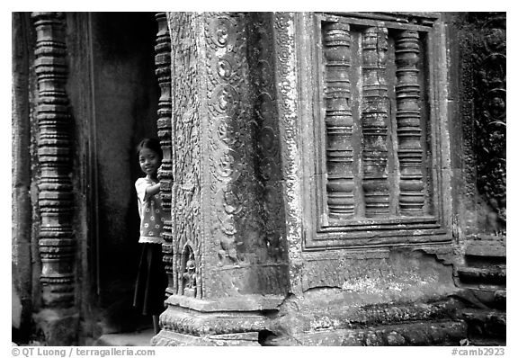 Girl hides in Ta Prom. Angkor, Cambodia