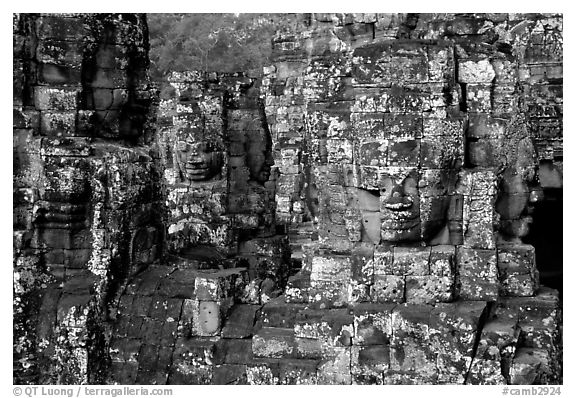 Large stone smiling faces on upper terrace, the Bayon. Angkor, Cambodia