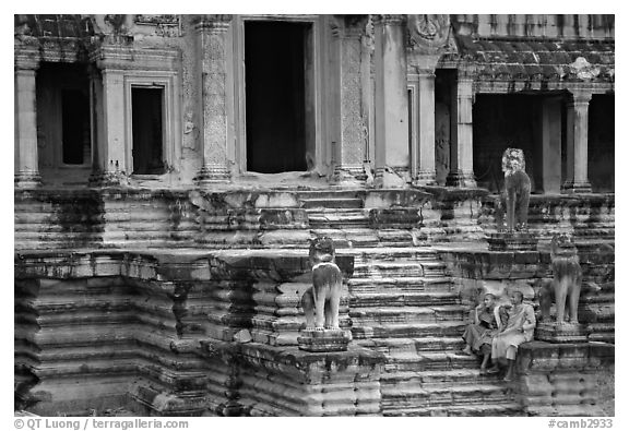 Buddhist monks on stairs, Angkor Wat. Angkor, Cambodia (black and white)