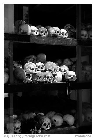 Skulls of executed prisoners, Choeng Ek Killing Fields memorial. Phnom Penh, Cambodia (black and white)