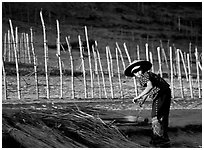 Villager and fence. Mekong river, Laos ( black and white)