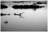 Fisherman casts net at sunset in Huay Xai. Laos (black and white)