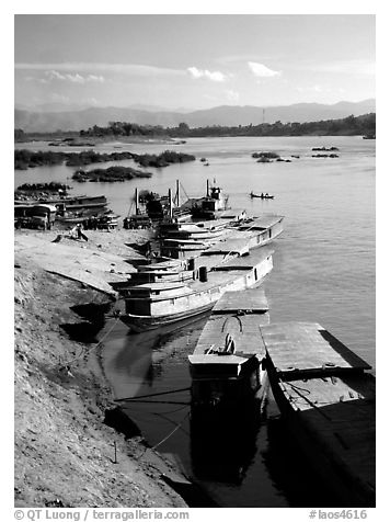 Slow passenger boats in Huay Xai. Mekong river, Laos (black and white)