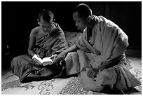Buddhist novice monks reading. Luang Prabang, Laos ( black and white)