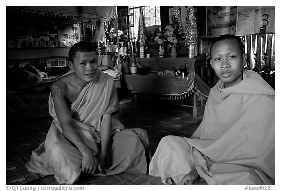Buddhist novice monks inside temple. Luang Prabang, Laos