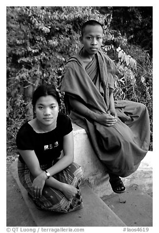Buddhist novice monk and his sister. Luang Prabang, Laos (black and white)