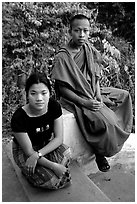 Buddhist novice monk and his sister. Luang Prabang, Laos ( black and white)