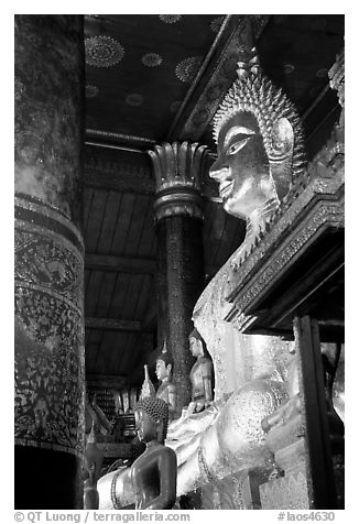 Buddha statues on altar, Wat Xieng Thong. Luang Prabang, Laos (black and white)