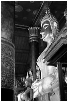 Buddha statues on altar, Wat Xieng Thong. Luang Prabang, Laos ( black and white)
