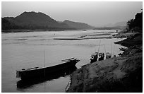 Dusk on the Mekong river framed by coconut trees. Luang Prabang, Laos ( black and white)