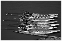Fast boats on the Mekong river. With their 40 HPW Toyota engines, they cruise at 50 mph on the river. Mekong river, Laos ( black and white)
